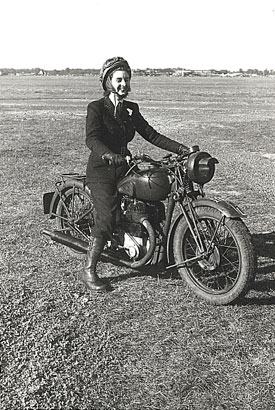 Female despatch rider wearing Air Transport Auxiliary uniform.