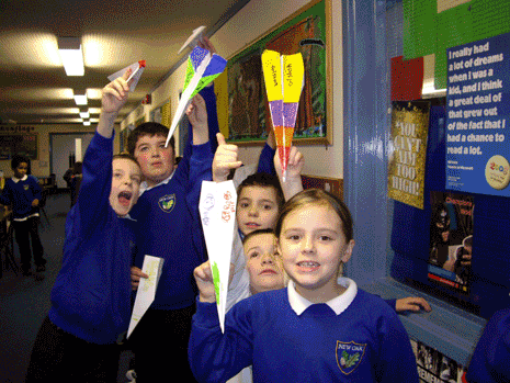 These photos were taken in the Year 4 class at New Oak Primary School in Hengrove, Bristol. They show the children making balloon rockets, parachutes, tissue-paper balloons and paper aeroplanes, drawing their ideal aeroplane, and finding out about wings.