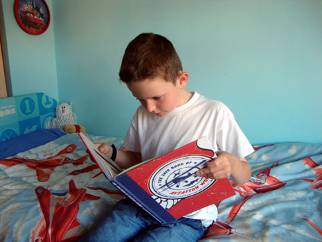 Jacob Cook, aged 8, reading the book.