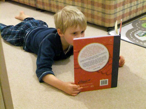 Wendy Massey has sent us pictures of her five year-old son reading the book which he obtained from his local library.