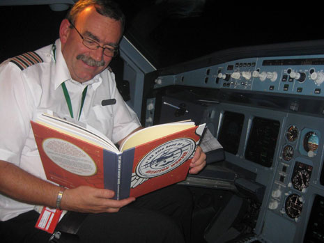 Bob checking his knowledge at 35,000 feet.