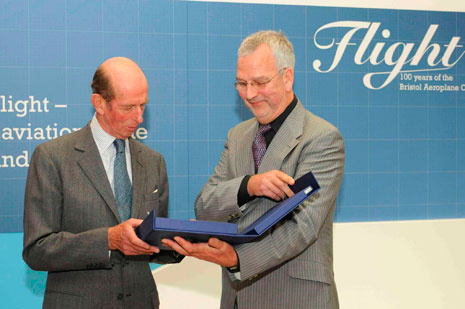 Alan Dean (Component Coating and Repair Services Ltd) handing over a presentation box containing copies of the BAC 100 publications.