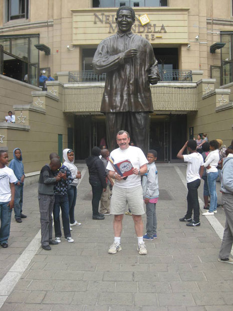 Bob with the statue of Nelson Mandela in Johannesburg.